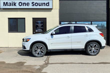 White 2018 Mitsubishi RVR with winter window tint setup